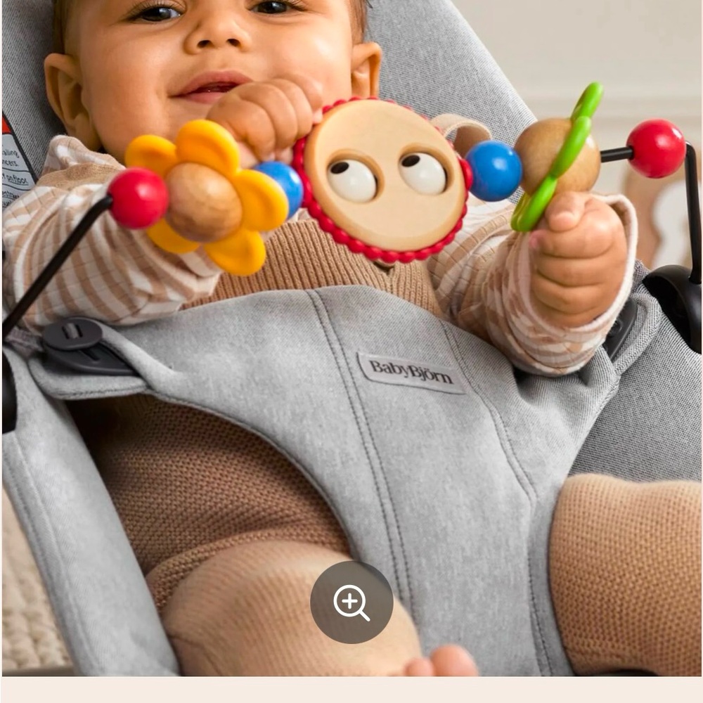 Baby Bjorn toy bar with googly eyes